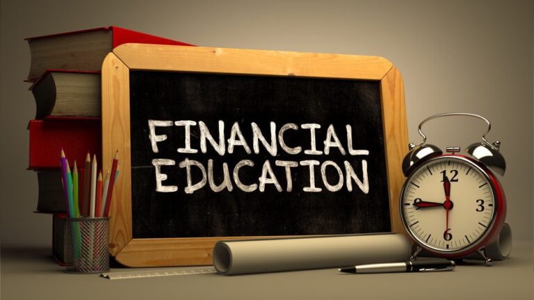 financial education handwritten by white chalk on a blackboard.
